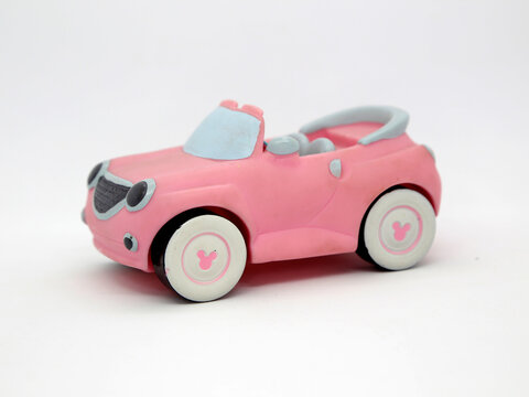 Minnie Mouse pink car. Toy. Cartoon character from Walt Disney Pictures Studios. Minnie is Mickey Mouse's girlfriend. Isolated white. Plastic toys for childrens. Vehicle. Toy car.