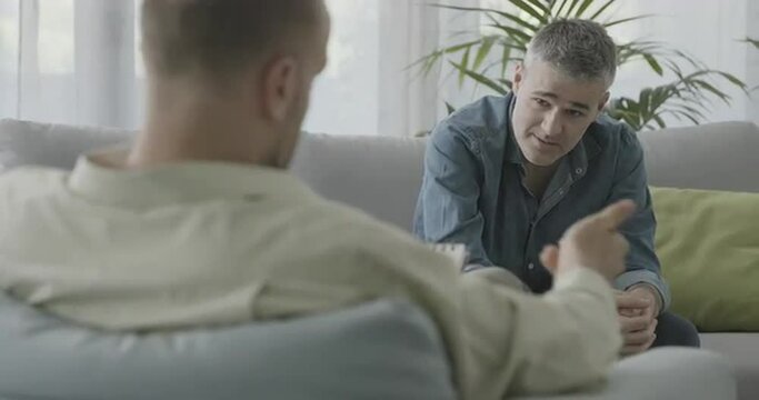 Man having a therapy session with a professional psychologist