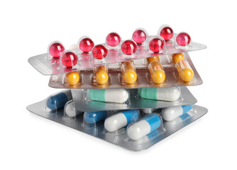 Stack of blisters with different pills on white background