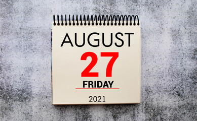 Wall calendar with a red pin - August 27
