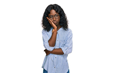 Beautiful african young woman wearing casual clothes and glasses thinking looking tired and bored with depression problems with crossed arms.