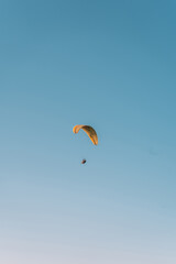  Paragliding at Fethiye Oludeniz. Paragliding is a free flying sport where the pilot launches themselves by foot.Amazing aerial view of beautiful sunset Blue Lagoon in Oludeniz, Turkey.