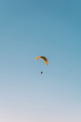  Paragliding at Fethiye Oludeniz. Paragliding is a free flying sport where the pilot launches themselves by foot.Amazing aerial view of beautiful sunset Blue Lagoon in Oludeniz, Turkey.