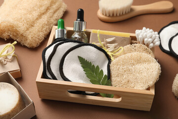 Different eco friendly products on brown background