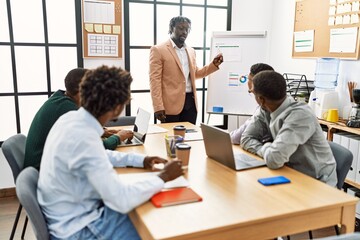 Group of african american business workers listening boss conference during work meeting at the office.