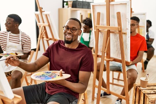 Group of young african american artist man smiling happy drawing at art studio.
