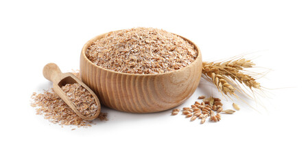 Wooden bowl and scoop with wheat bran on white background