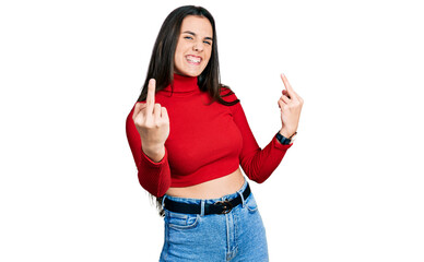 Obraz na płótnie Canvas Young brunette teenager wearing red turtleneck sweater showing middle finger doing fuck you bad expression, provocation and rude attitude. screaming excited