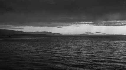 Sunset at Bellingham Bay, Washington. Cornwall Beach Park. Blue hour ocean view. Black and white.