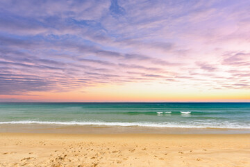 Fototapeta na wymiar Beautiful beach with clouds in the sunset.