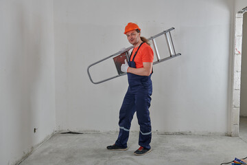 a worker is holding a stepladder on his shoulder