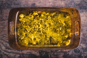 vegan oven baked smashed potatoes with pesto sauce and plant-based cheese, healthy plant-based food