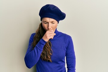 Young blonde woman wearing french look with beret feeling unwell and coughing as symptom for cold or bronchitis. health care concept.