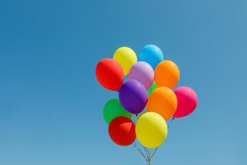 Bunch of colorful balloons against blue sky © New Africa