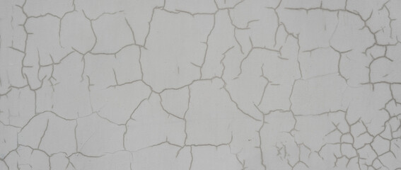 Old grey wall with cracks. Detailed background with beautiful abstract pattern on aged cement wall.