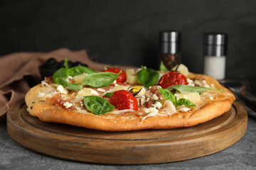 Delicious homemade pita pizza on grey table