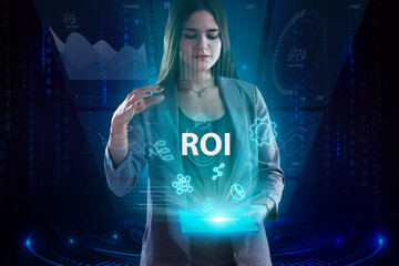 Business, Technology, Internet and network concept. Young businessman working on a virtual screen of the future and sees the inscription: ROI