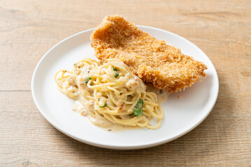 spaghetti pasta white cream sauce with fried fish