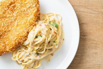 spaghetti pasta white cream sauce with fried fish