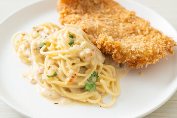 spaghetti pasta white cream sauce with fried fish