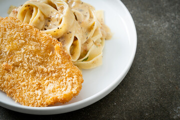fettuccine pasta white cream sauce with fried fish