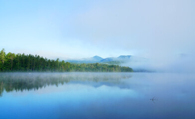  landscape of morning lake in the fog