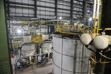 Pavlodar region, Kazakhstan - 12.10.2015 : Pipes and tanks with a centrifuge for processing sulfide ore