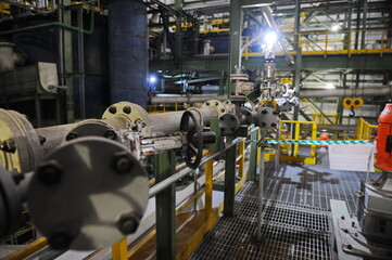 Pavlodar region, Kazakhstan - 12.10.2015 : Pipes and tanks with a centrifuge for processing sulfide...