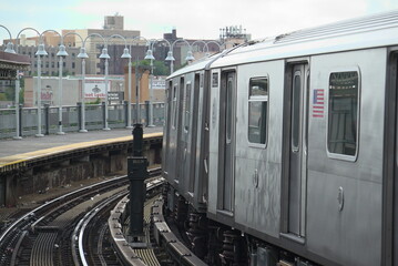 metro train in new york heading through a curve on the rail road track