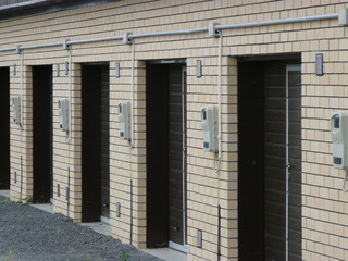 New brick garages. Modern garages are lined up. Car storage space.