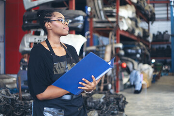 Businessman using laptop computer working or checking stock in warehouse factory, entrepreneurship or business owner concept