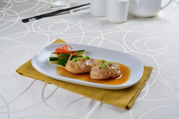 braised cook scallop with cuttlefish prawn paste ball seafood in oyster sauce in white background asian halal menu