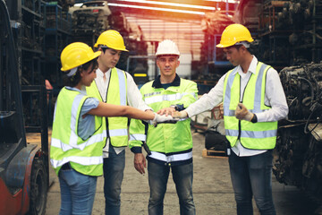 Worker or Engineer or technician work in factory and talk with team, stack hands as teamwork concept
