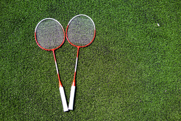 children's game of badminton racket and ruffle on the field