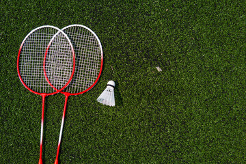 children's game of badminton racket and ruffle on the field