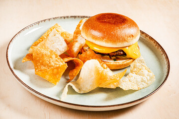 burger with chips on the plate