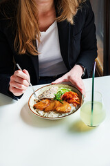 woman eating in the asian restaurant
