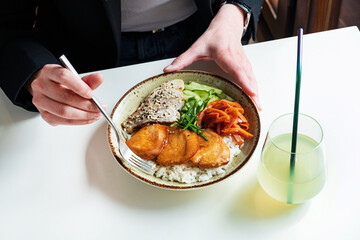 woman eating in the asian restaurant