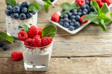 Curd dessert with berries and mint.