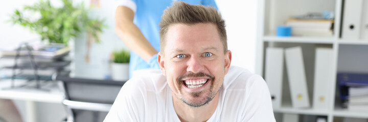 Obraz premium Portrait of smiling man at proctologist appointment