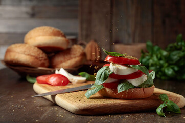 Sandwich with mozzarella, tomatoes, and basil.