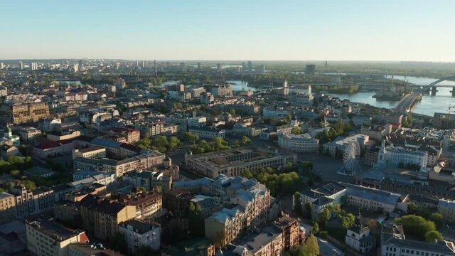 Aerial view of church and cyti. City At Sunset. Aerial view of small old european town. Aerial panoramic view of historic brick buildings. 