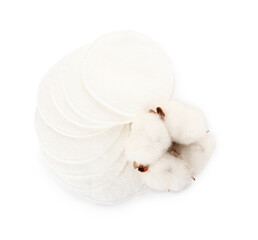 Cotton pads and flower on white background