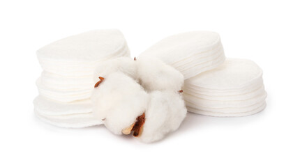 Cotton pads and flower on white background