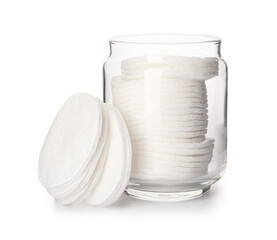 Glass jar with cotton pads on white background