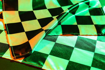 Racing flags on dark background, closeup