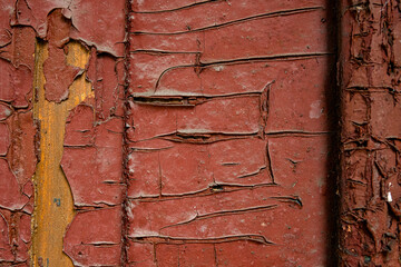 Texture of texture cracks of old paint of a stone, metal, wooden wall with peeling paint, floor of destruction and corrosion of metal and rusty antiquity, chips and paint smears