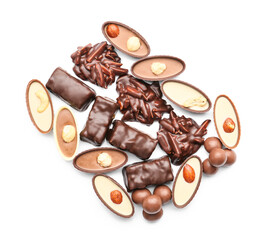 Different chocolate candies on white background