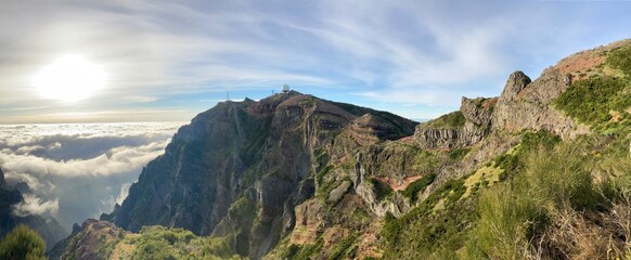 Panoramic landscape view to Pico do Arieiro mountain peak with radar ball antenna tower station in Madeira island, Portugal. Beautiful morning landscape shot.