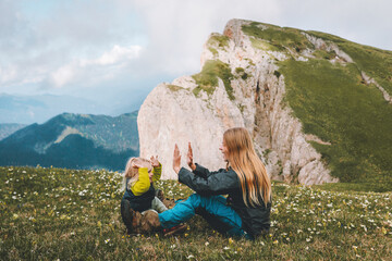 Naklejka premium Mother playing with daughter in mountains family lifestyle active vacations mom with child together parenting concept